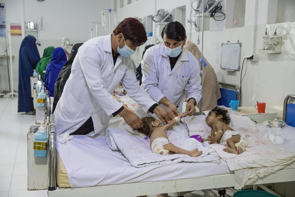 Paediatric Intensive Care <br> Due to high numbers of patients needing treatment there are two children sharing a bed at the paediatric intensive care unit at the MSF-supported Boost hospital in Lashkar Gah, Helmand province.