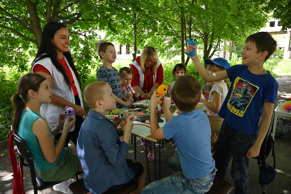 Group mental health session for children in shelter, Ukraine. © MSF