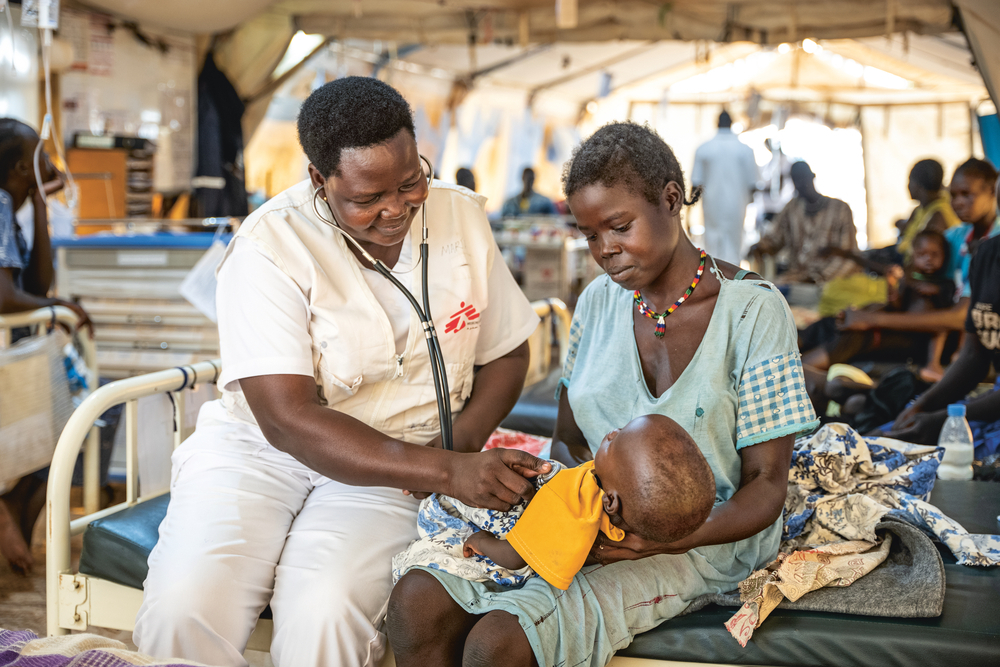 In Aweil, an nurse examines 13-month-old boy brought to the hospital suffering from malnutrition. © Oliver Barth/MSF