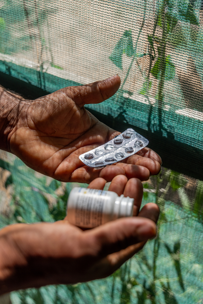 Amer, a 36-year-old Syrian refugee in Lebanon holds his empty hypertension medication. © Carmen Yahchouchi for MSF