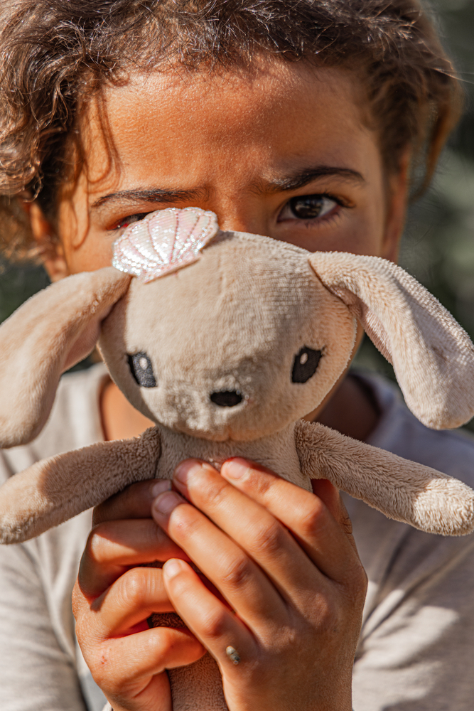 A young Syrian refugee clings to a teddy bear in Qaa, northeast Lebanon, finding comfort in a small token amidst the uncertainty of displacement. © Carmen Yahchouchi for MSF