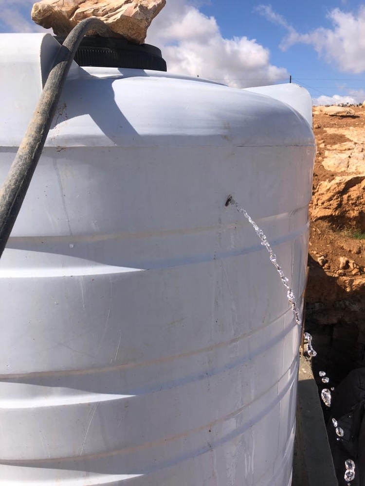 Water tanks with bullet holes, caused by settlers shooting at homes, herd, and water tanks, according to the community in West Bank. © MSF