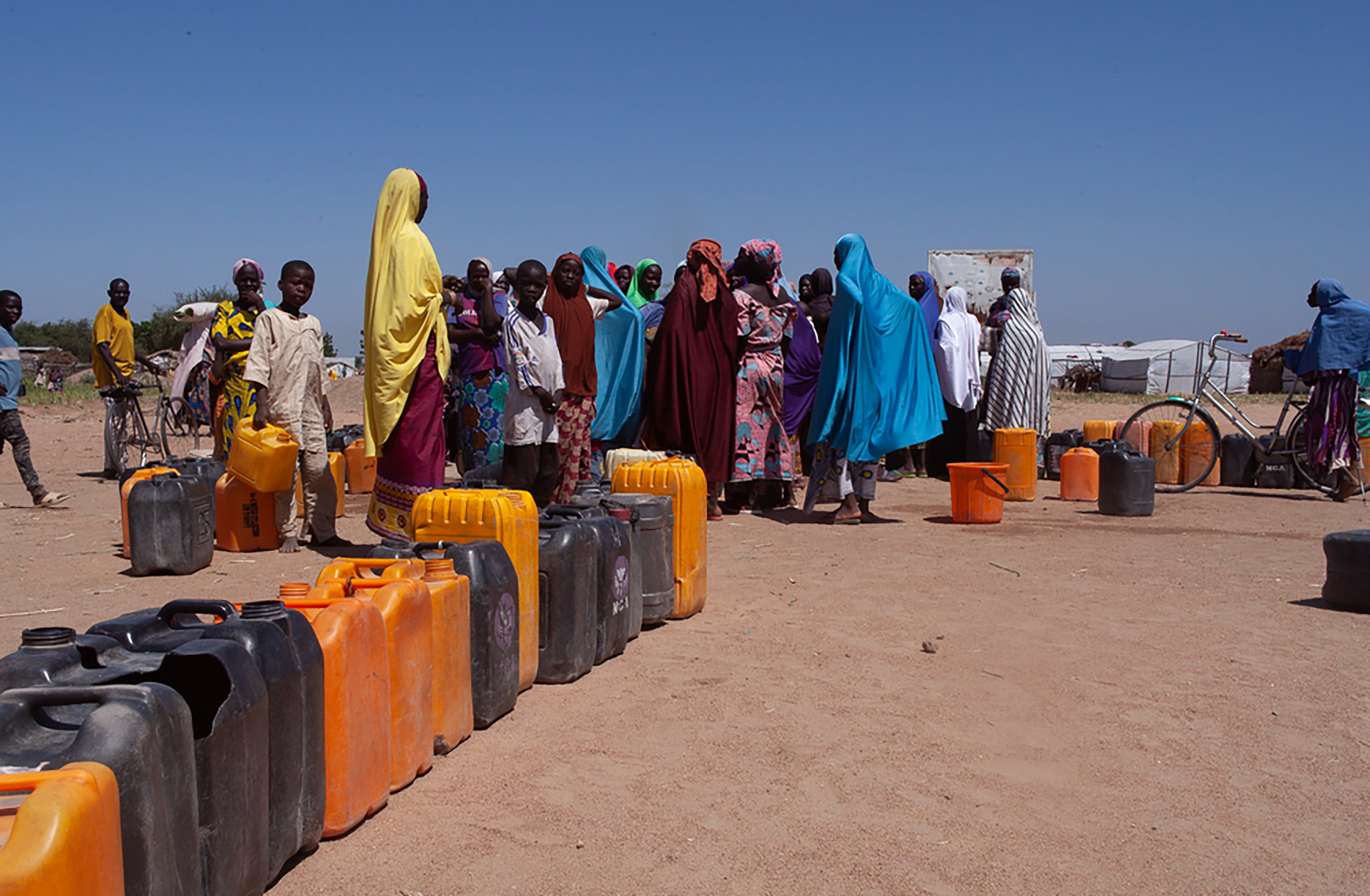 Women queue up at a borehole to collect water in Gwoza, Borno state, Nigeria. © Scott Hamilton/MSF