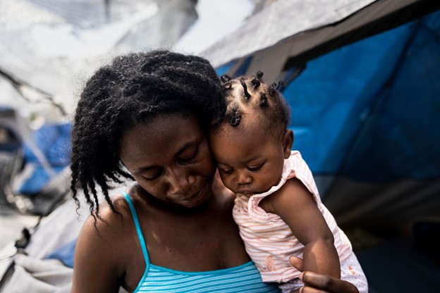 Dalila, 29, and her six-month-old daughter, Blandina, are living at the “Senda de Vida” migrant shelter in Reynosa, Mexico. Dalila left Haiti in 2017 and spent over four years in Chile until she and her husband decided to seek safety and dignity in the United States. Dalila was pregnant as they traveled through several countries, and she gave birth to Blandina when they crossed the border into southern Mexico. ©Yael Martínez/Magnum